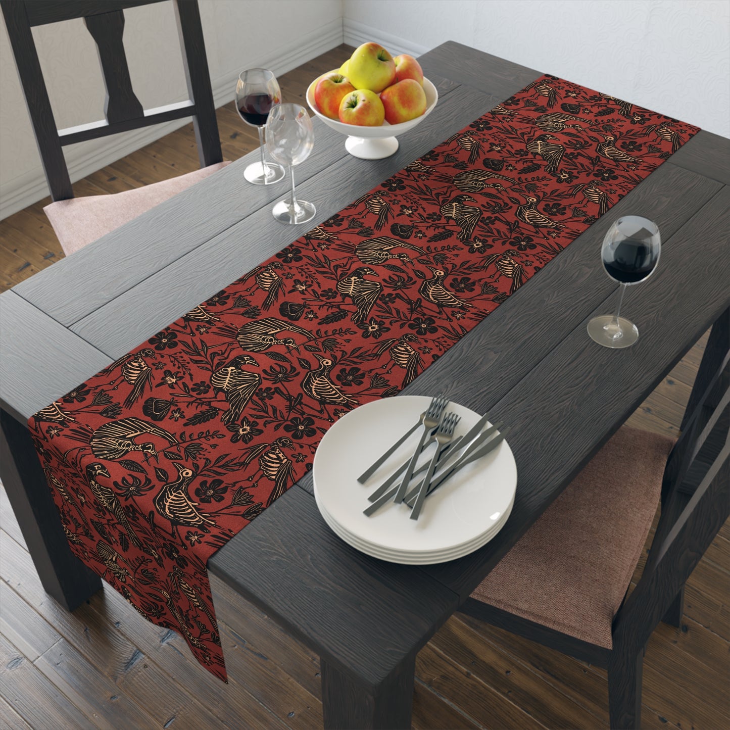 macabre autumn folk art floral bird skeleton table runner in rust red orange on a black table with wine glasses and apples