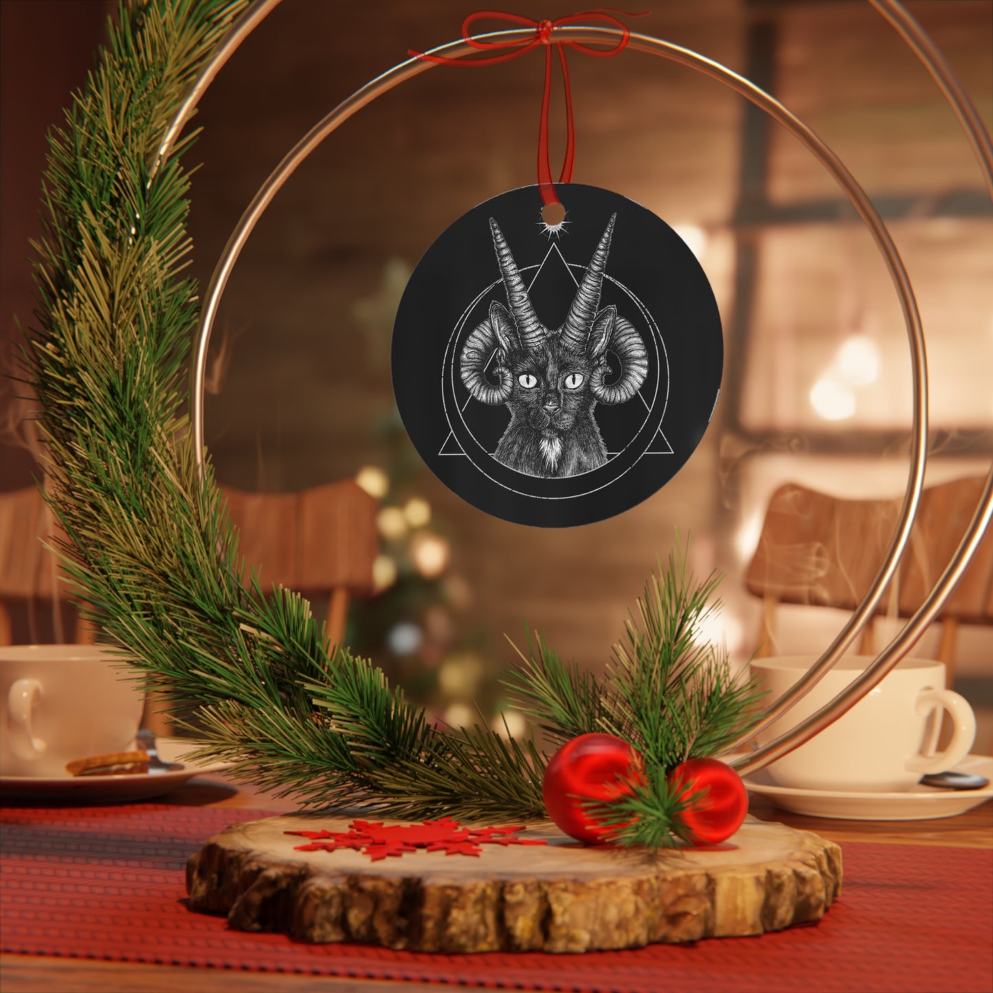 A round aluminum ornament with a black base featuring an illustration of a gothic demon cat with horns in the center