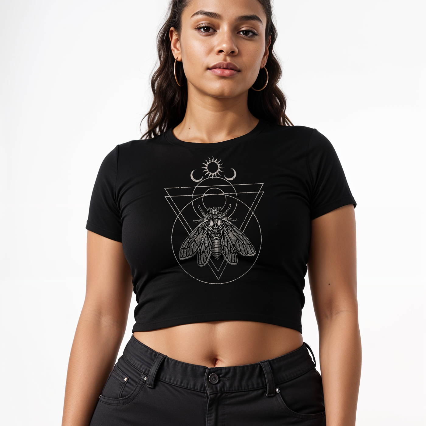 Woman wearing a black t-shirt with a geometric witchy cicada design on a white background