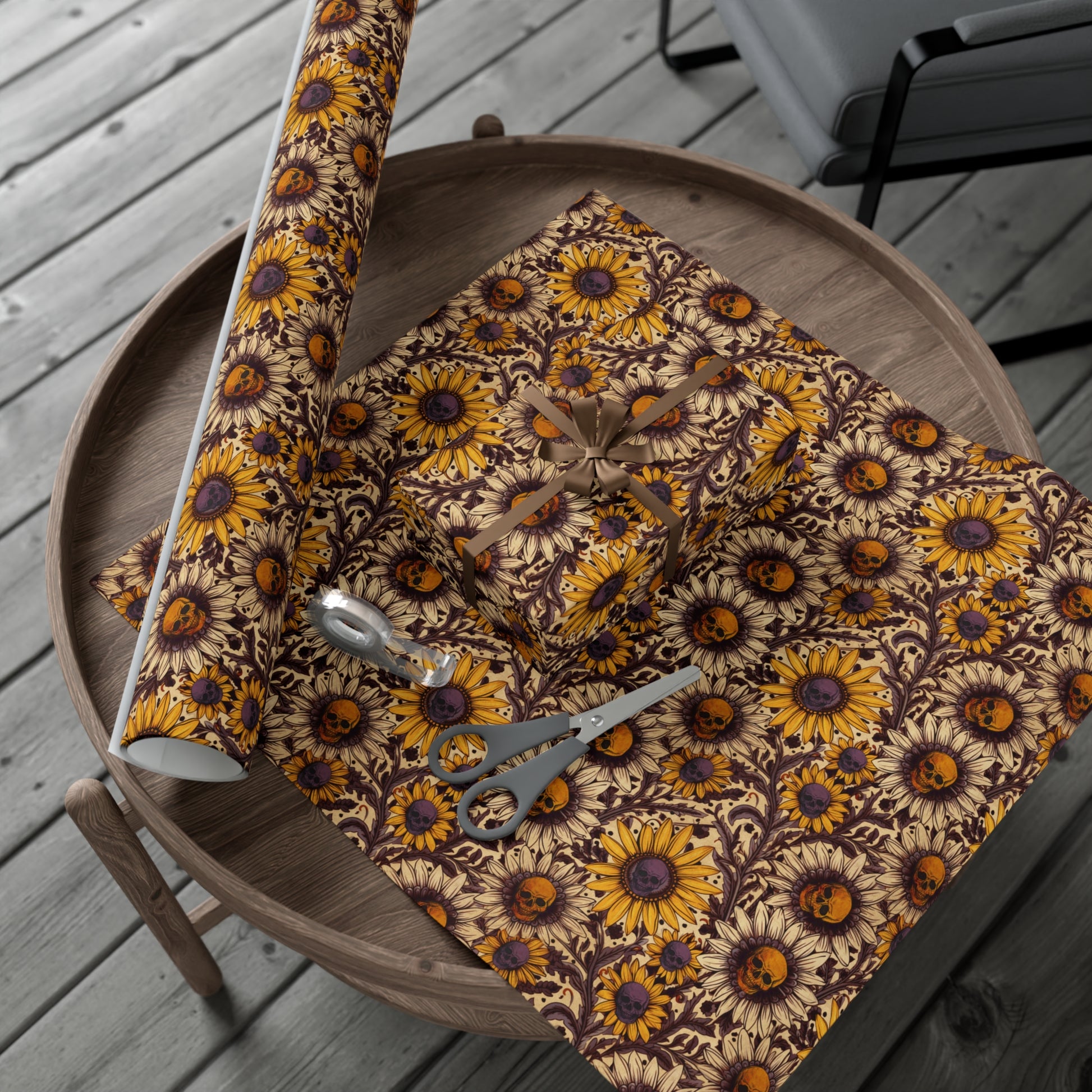 wrapping paper with spooky sunflower pattern on a wooden tray outdoors