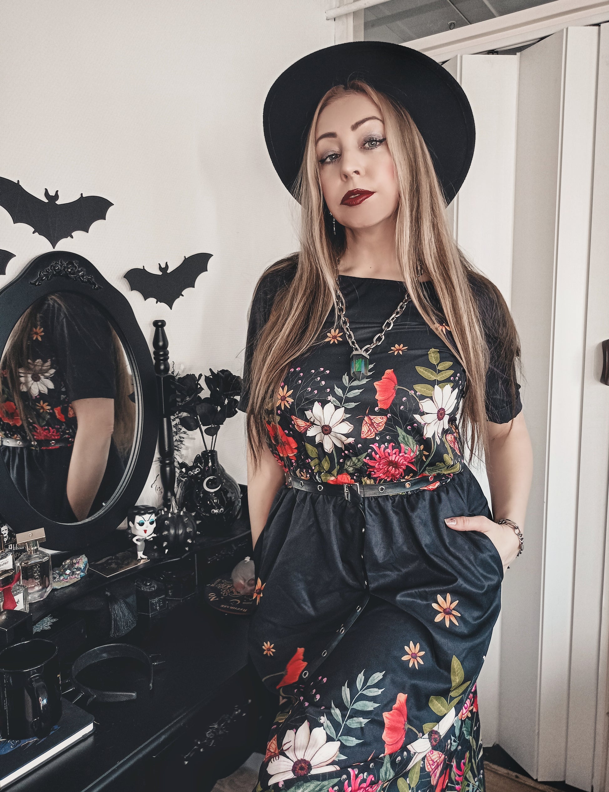 moody floral watercolor blouson dress on a gothic woman in in a black hat