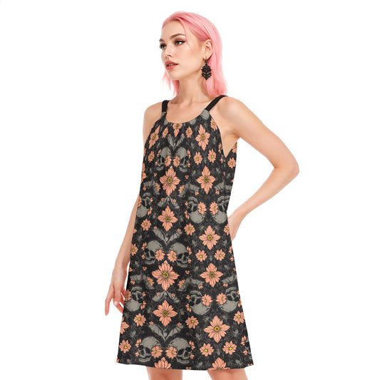 Pastel halloween dress with pink flowers bats and skulls on a gothic woman with pink hair