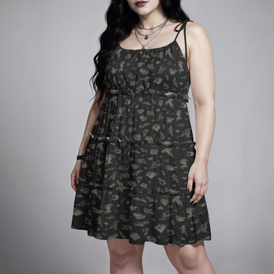 Gothic woman wearing a black patterned witchy spells and potions dress against a gray background