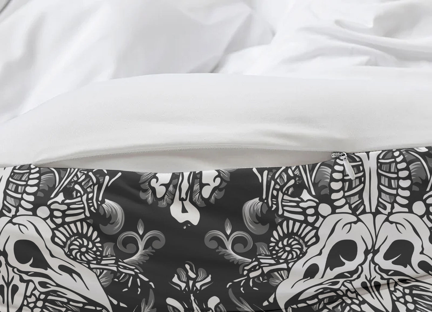 Close-up of a black and white patterned fabric with skulls on a white background