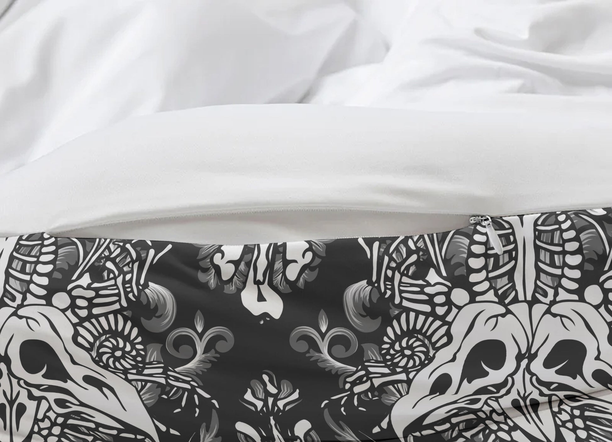 Close-up of a black and white patterned fabric with skulls on a white background