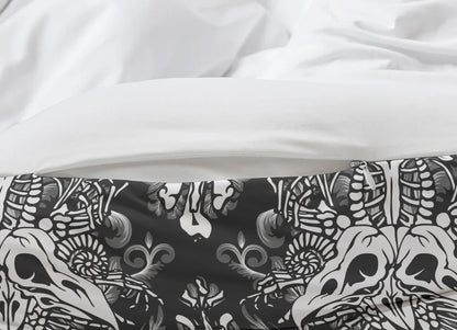 Close-up of a black and white patterned fabric with skulls on a white background