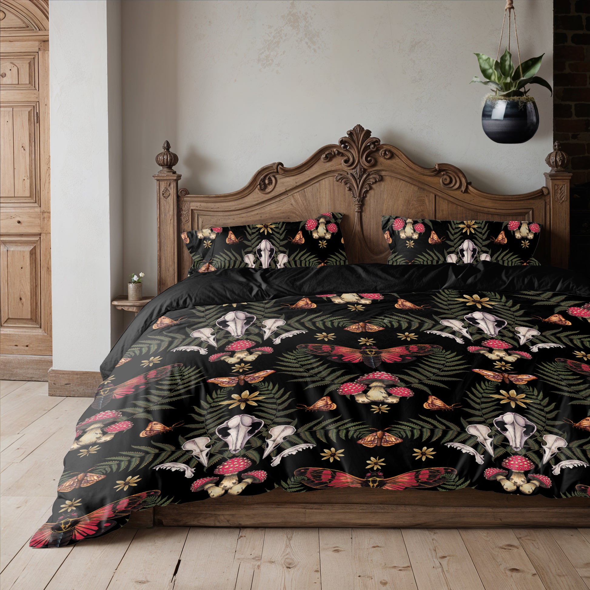 Bed with skull and floral patterned bedding in a bedroom setting.