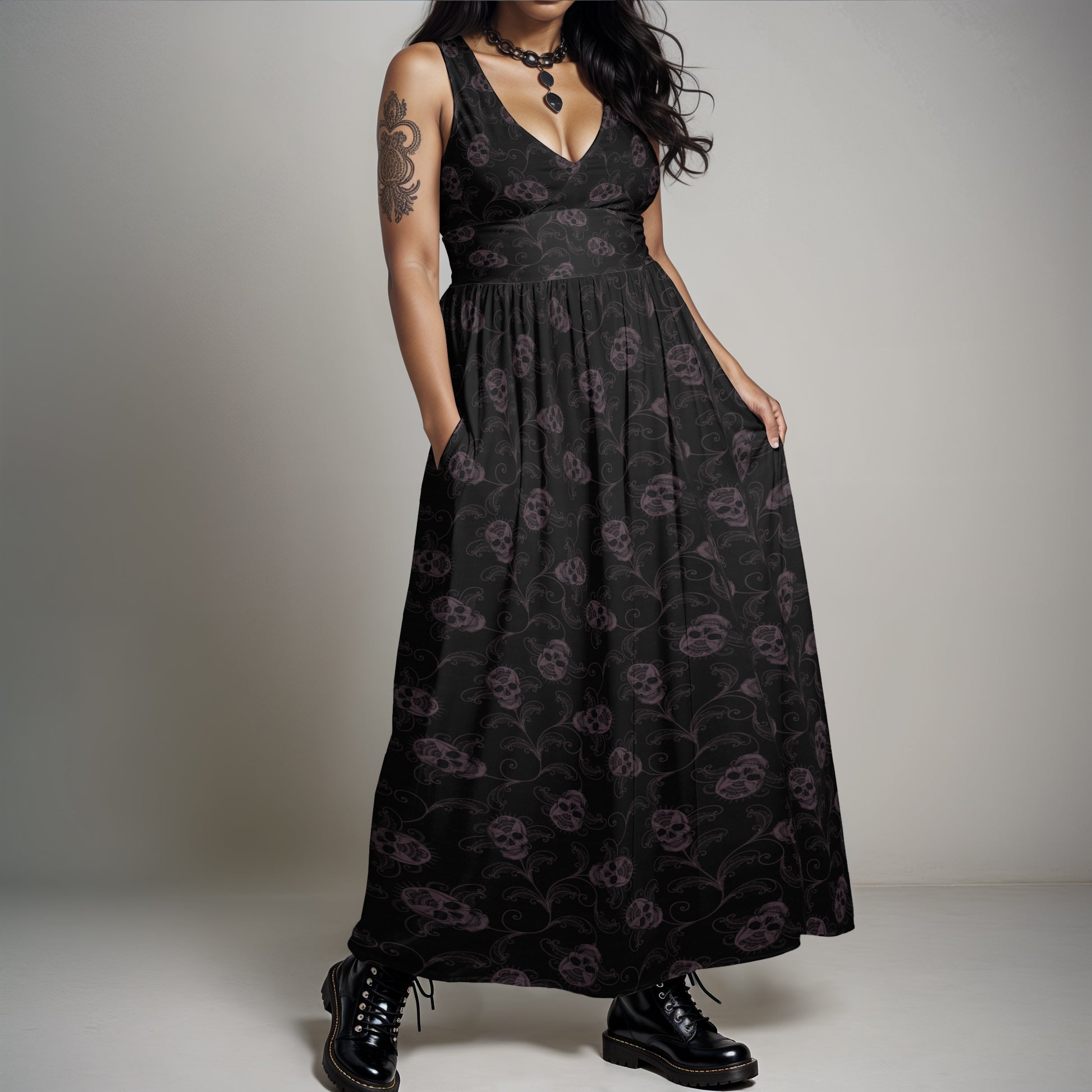 dark ornate goth skull sleeveless maxi-dress with pockets on a plus sized gothic woman wearing combat boots