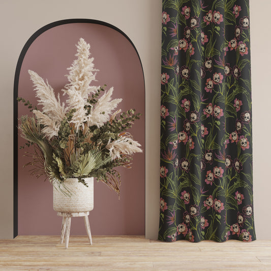 colorful gothic floral skull flower window curtain next to a witchy potted plant