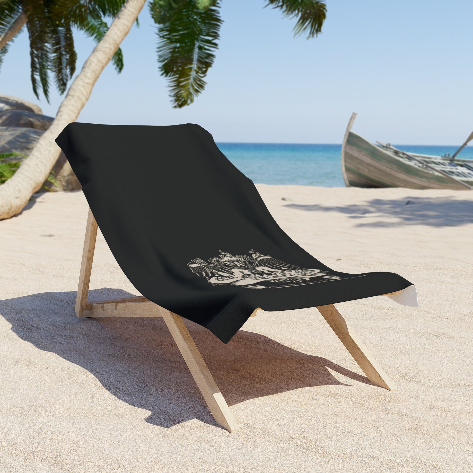 funny bathomet cleanliness is godlessness satanic pun beach towel on a wooden lounger on a tropical beach with palm trees and a row boat