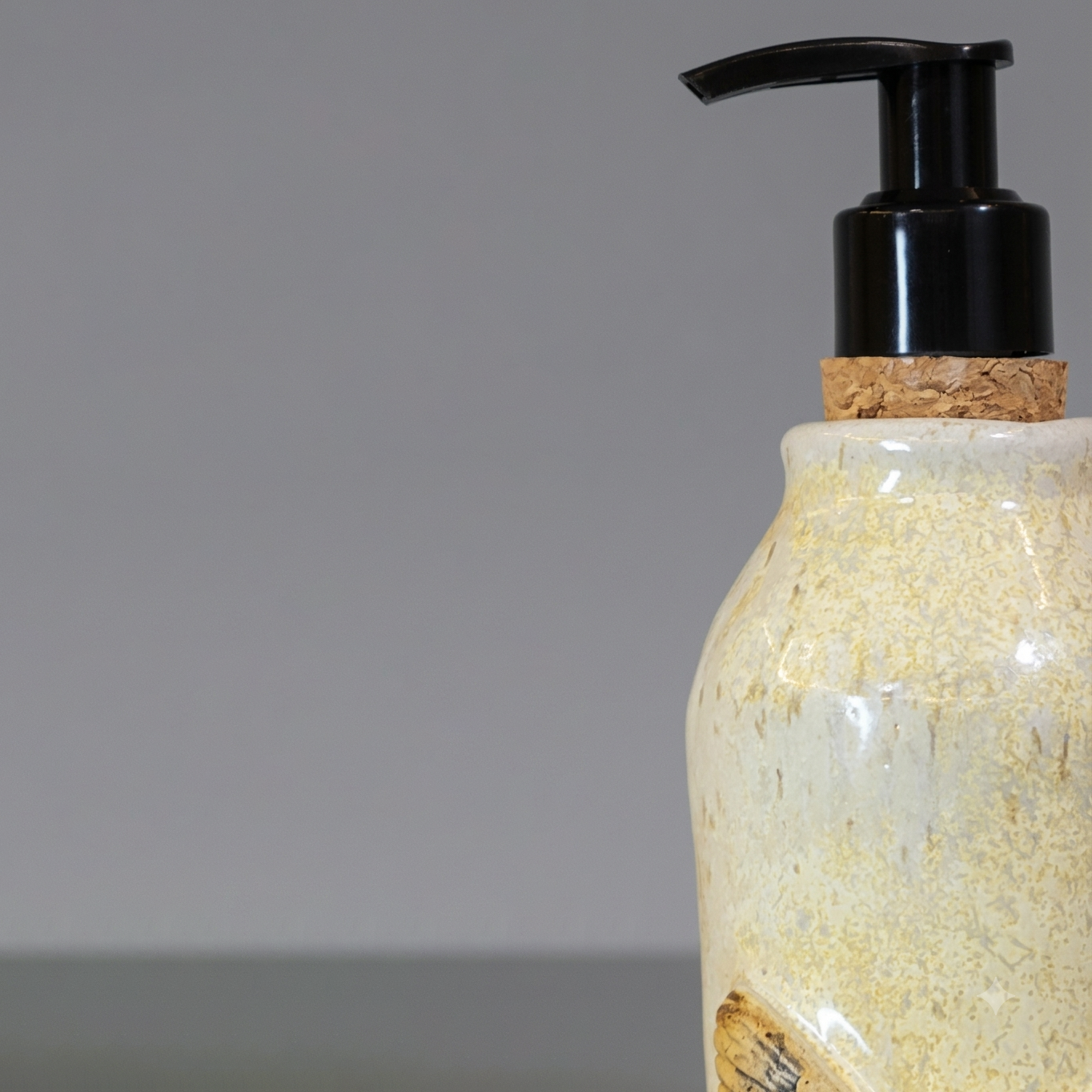 Ceramic bottle with cork lid on a gray background