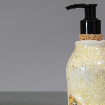Ceramic bottle with cork lid on a gray background