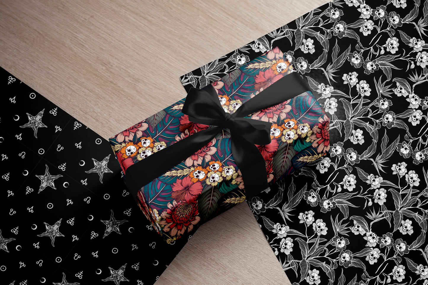 gothic Floral-patterned gift box with a black ribbon on a decorative fabric background