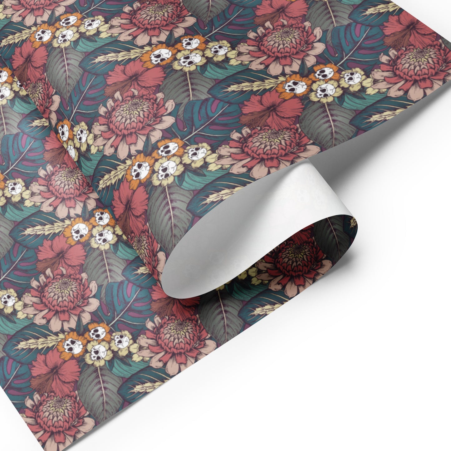 Floral skull patterned paper with a roll of it on a white background