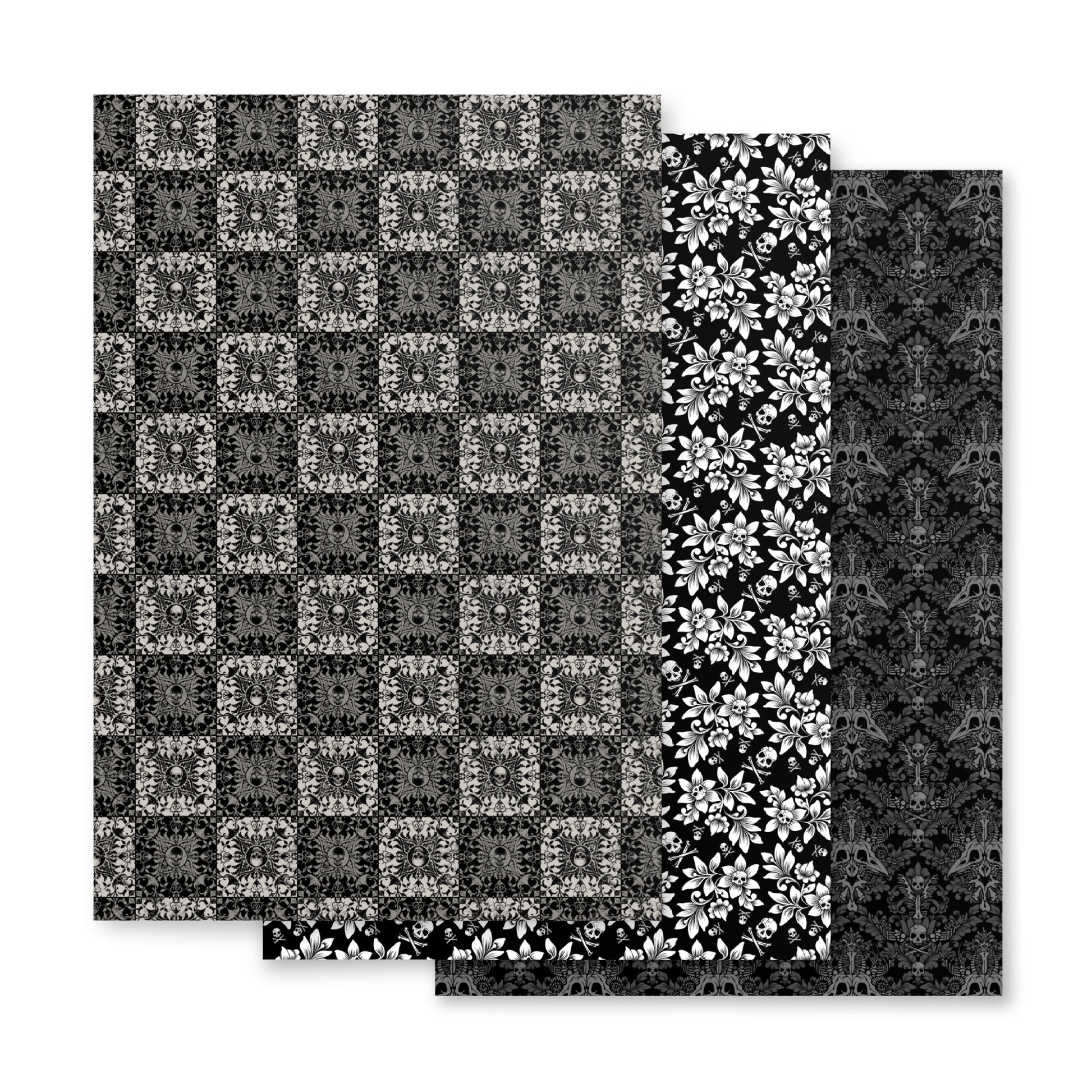 Four black and white patterned paper sheets on a white background