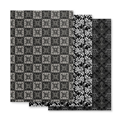 Four black and white patterned paper sheets on a white background