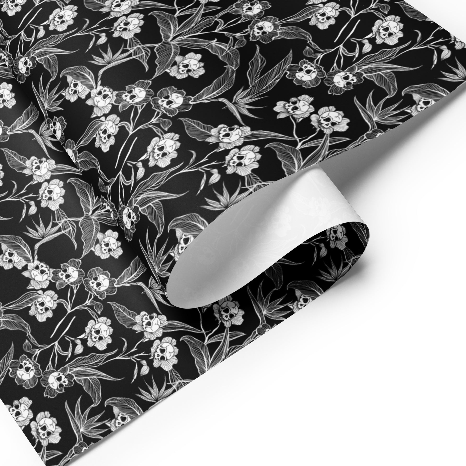 spooky Floral patterned paper with white flowers and skulls on a black background