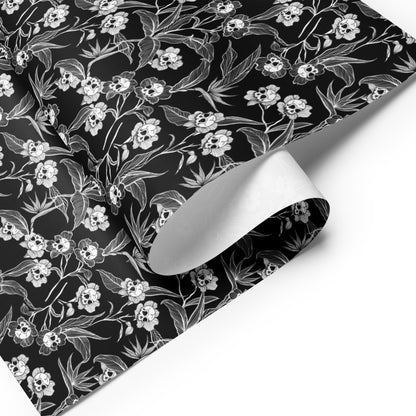 spooky Floral patterned paper with white flowers and skulls on a black background