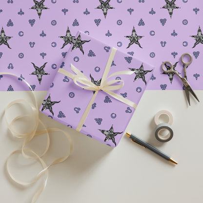 pink satanic Gift box with decorative ribbon on a white surface with purple wrapping paper and star pattern.