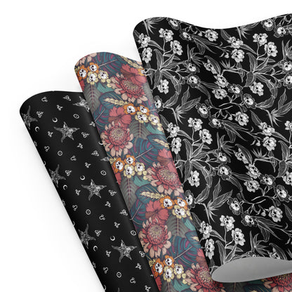 Three gothic floral-patterned wrapping paper sheets on a white background